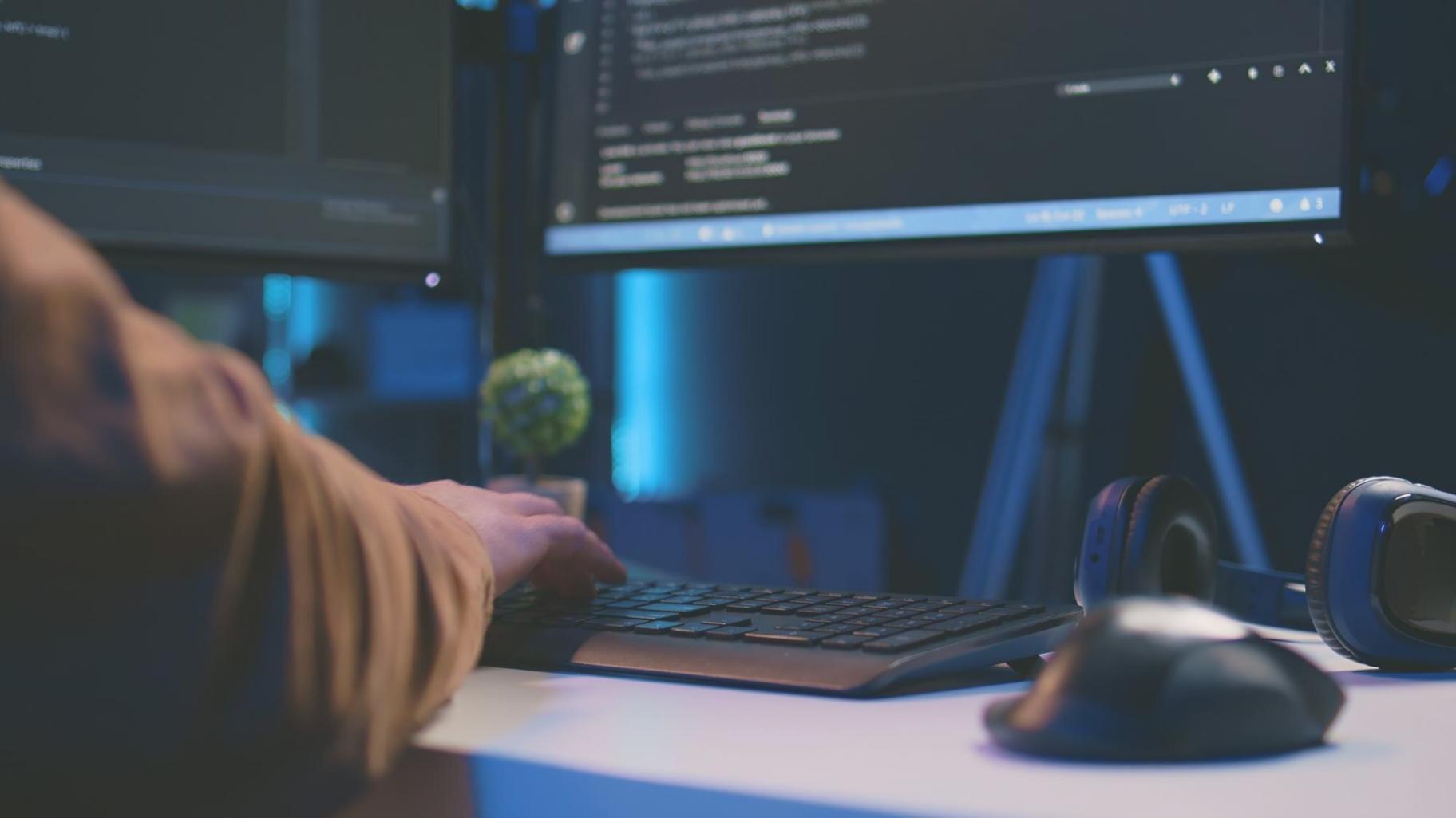 Modern office environment with productivity software running on multiple screens